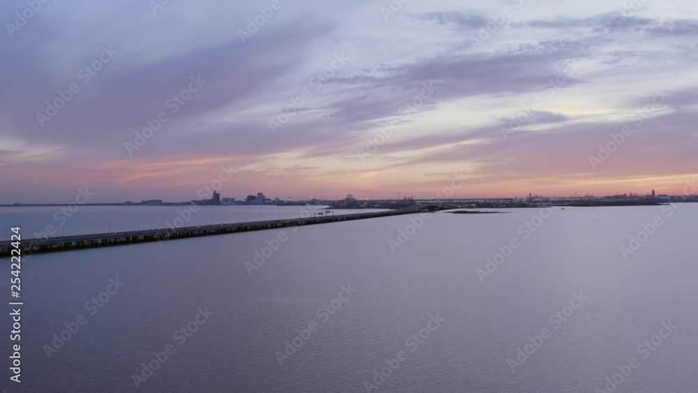 Flying away from Corpus Christi along a bridge at Nueces bay during a sunset. Flying away from Corpus Christi along a bridge at Nueces bay during a sunset.