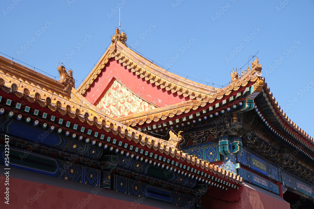 Tiled roof and facade decorated with a Chinese pattern. Palace in The Forbidden City, Beijing, China