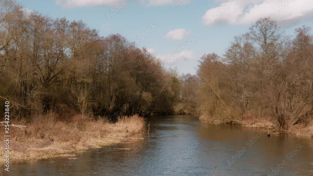 the beginning of spring. wild fast river among the thickets the beginning of spring. wild fast river among the thickets