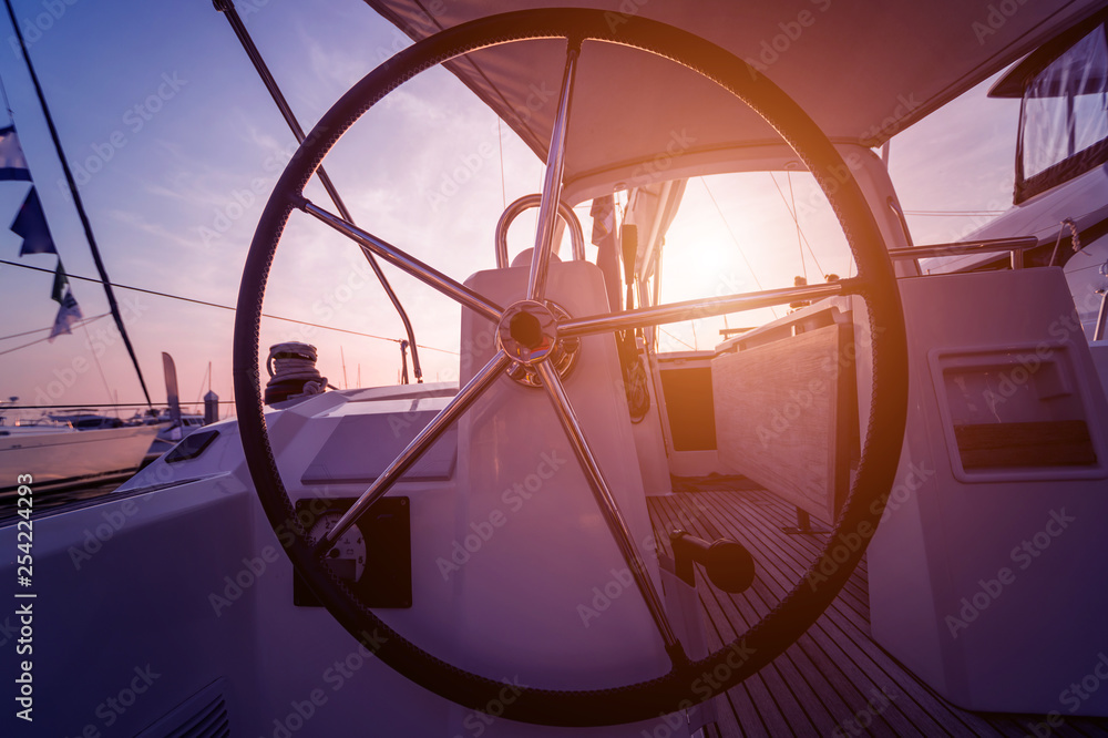 A modern speed boat yacht steering wheels.