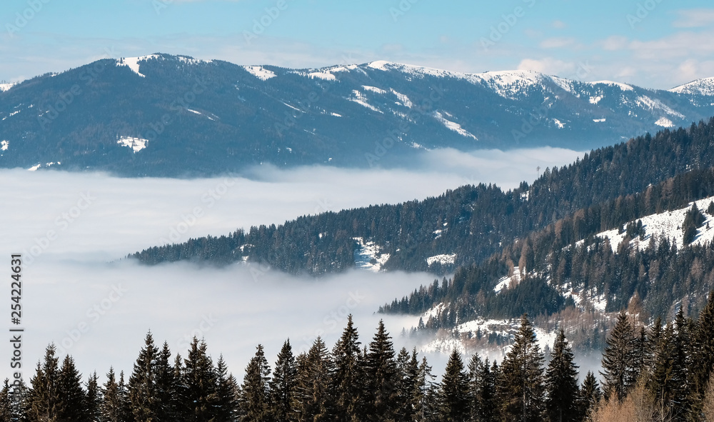 Panorama of Snow Mountain Range Landscape with Blue Sky from ski resort Gerlitzen, Austria.