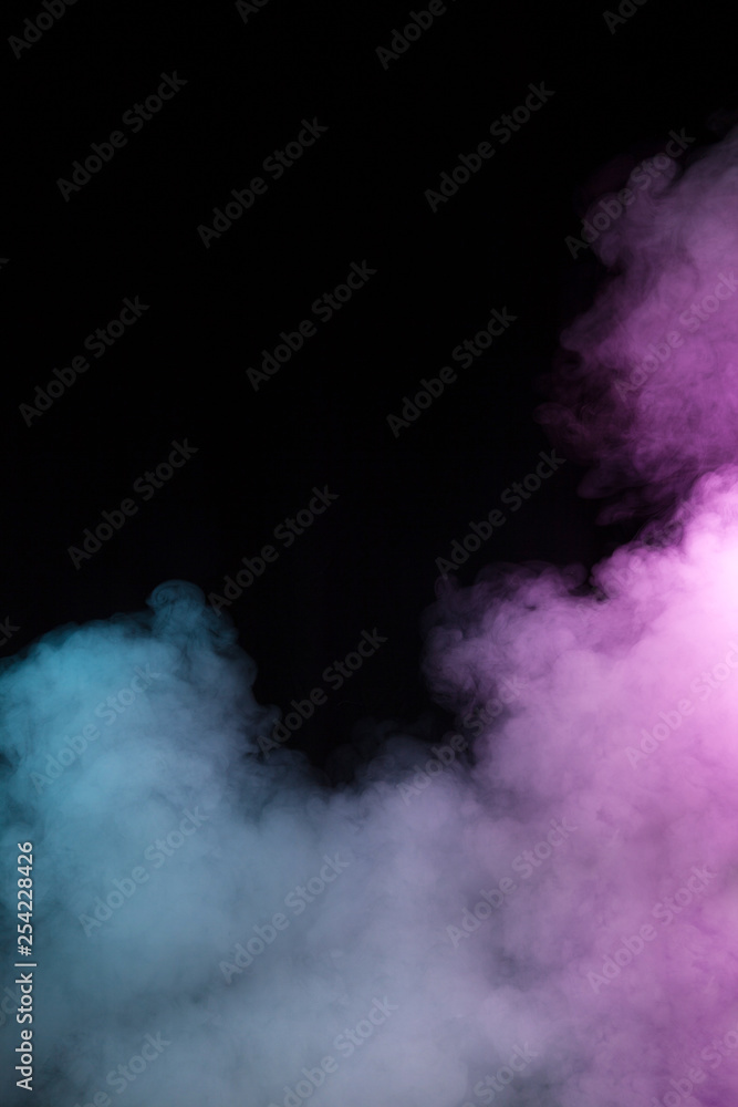 Naklejka premium Colorful smoke on black background