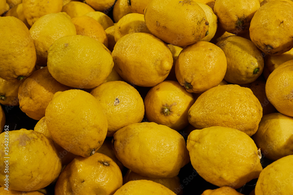 Lots of fresh, ripe yellow lemons. Macro photo