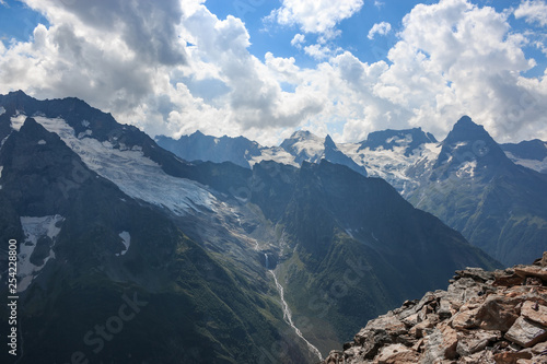 Panorama of mountains scene with dramatic blue sky in national park of Dombay © TravelFlow