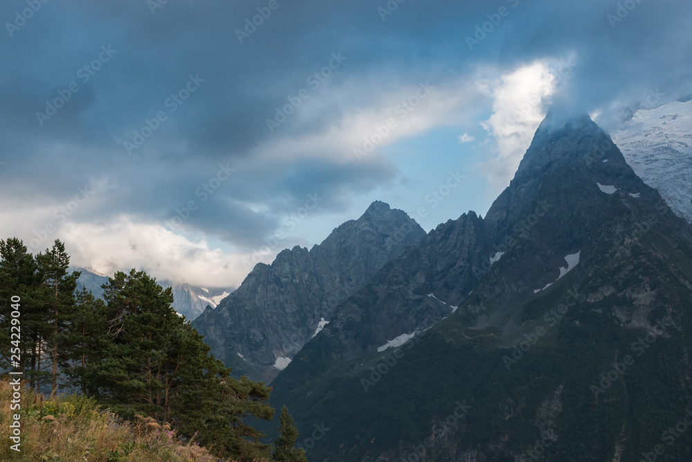 Panorama of mountains and forest scene in national park of Dombay, Russia