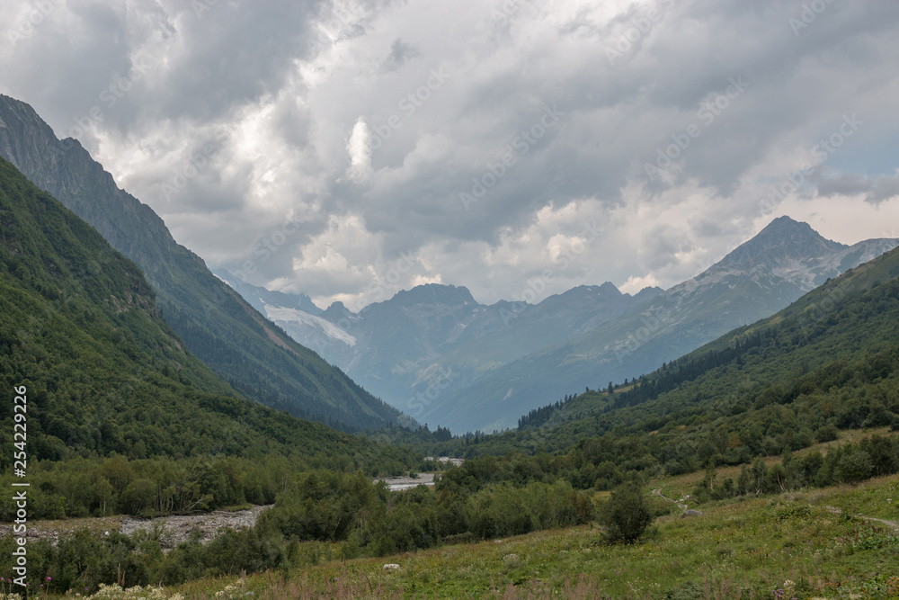 Panorama view on mountains with river scene in national park of Dombay