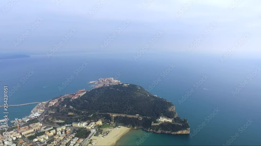 Aerial high angle view of Gaeta Italy coastline slow approach Mausoleum of Lucius Plancus Munazio on the tree coved Parco Monte Orlando Concept: coastline, travel, inspiring, tranquil, culture Aerial high angle view of Gaeta Italy coastline slow approach Mausoleum of Lucius Plancus Munazio on the tree coved Parco Monte Orlando Concept: coastline, travel, inspiring, tranquil, culture