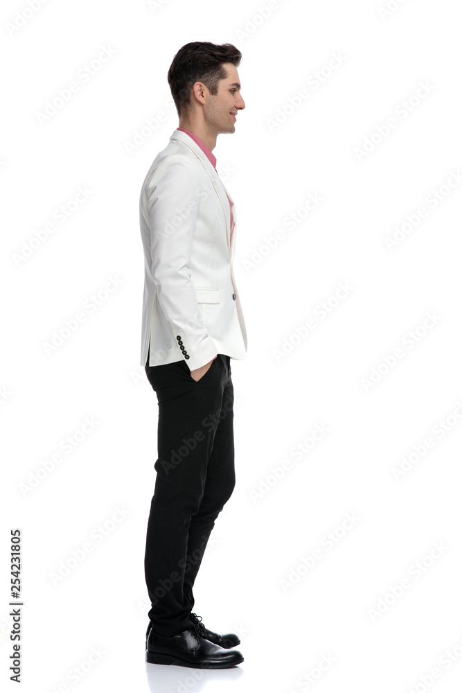 side view of an elegant man waiting in line side view of an elegant man waiting in line