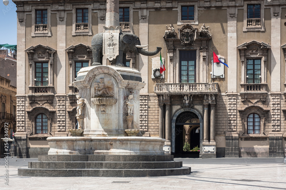 CATANIA, ITALY - JULY 06, 2014: Catania town main square center (Piazza del Duomo) with the Elephant statue the symbol of the city in Sicily, Italy