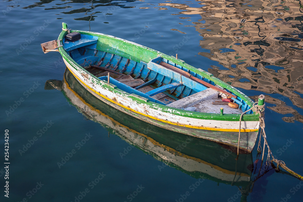Fototapeta premium Old boat floating on the water