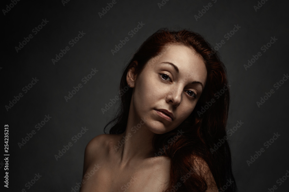 Portrait of beautiful nude lady on a black background. Portrait of beautiful nude lady on a black background.