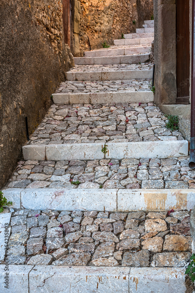 Stone steps to rustic house in old city
