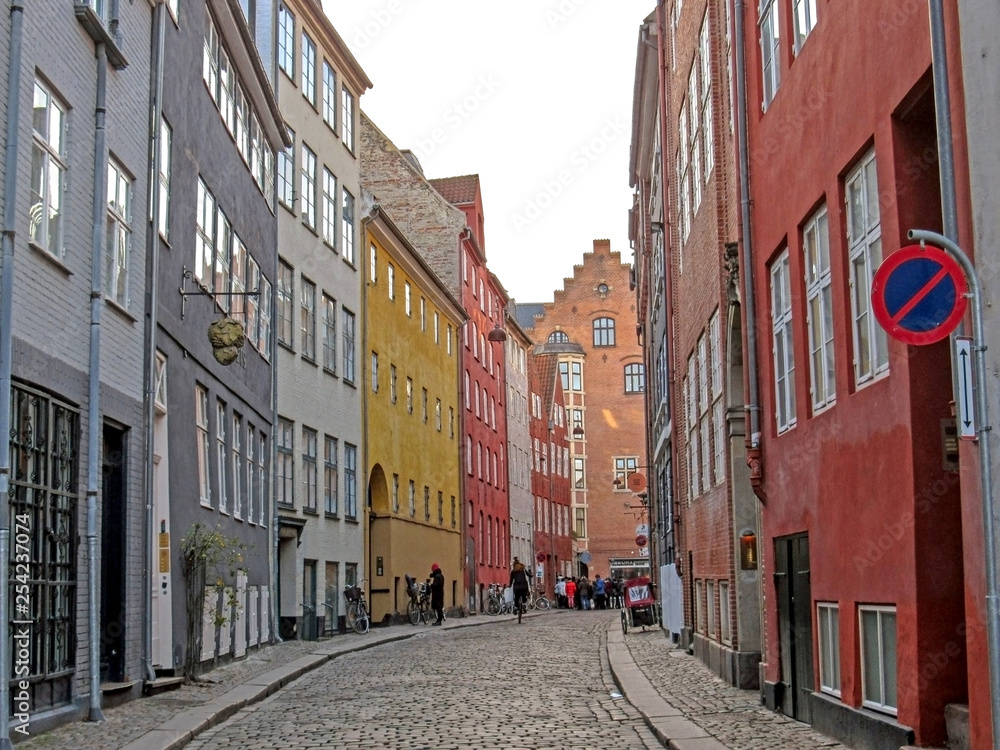 Typical Danish capital street with old architecture colorful houses, Copenhagen, Denmark