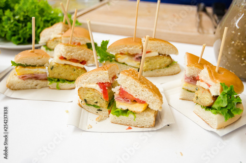 Sliced sandwiches on a disposable paper tray 