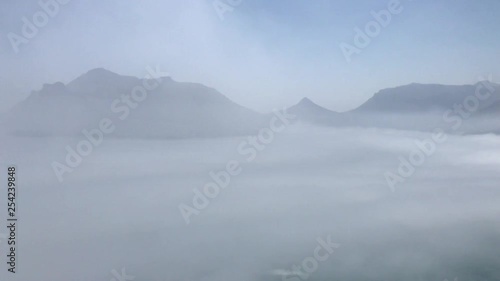 Misty mountains of Hout Bay , Little Lions head , the Sentinel and Karbonkelberg taken from Chapman’s Peak drive Cape Town South Africa. photo