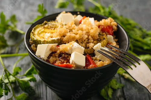 Baked vegetable salad with quinoa and Serbian cheese. Vegetarian dish.