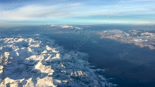 Wallpaper Mural Clean aerial view flying over snow capped mountains from left side of plane. Torontodigital.ca