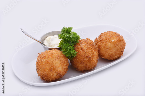 Cheese Balls. Deep fried cheese balls prepared from cow milk cheese with special butter.  On a white background