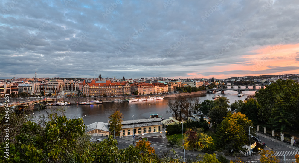 Gorgeous evening view on Prague city center, Vltava river and cascade of bridges, Czech Republic. Autumn Prague.