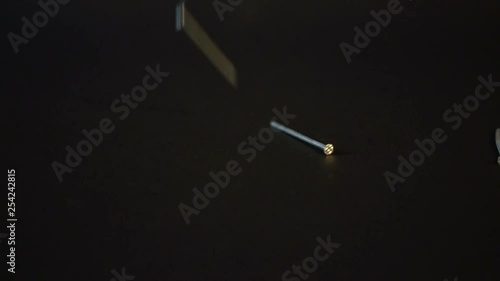 Nails falling on black background Sony a6300 100fps photo