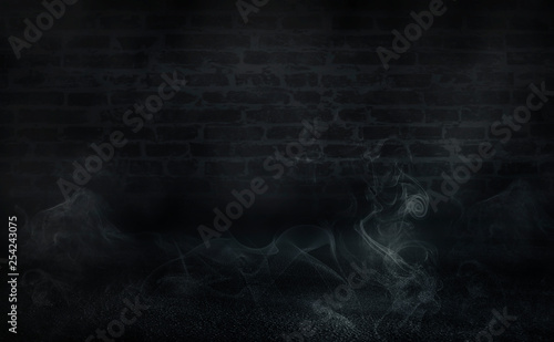 Empty scene background. Empty brick wall, concrete floor, spotlight, multicolored neon rays, bokeh.