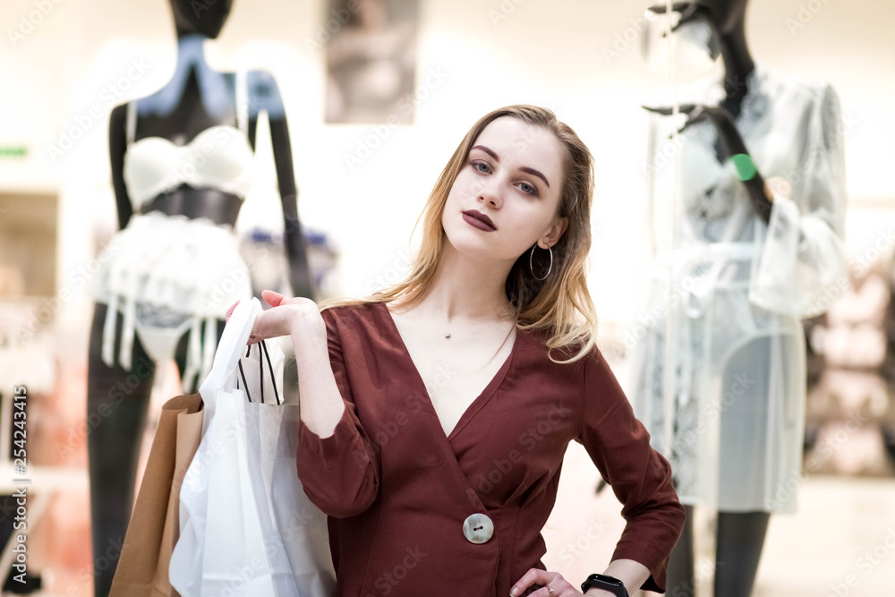 Girls shopping in a mall. Elegant young woman near lingerie store