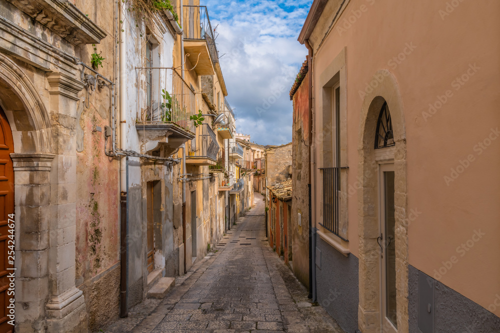 Typical italian narrow street on the island of Sicily in the city Ragusa, Italy