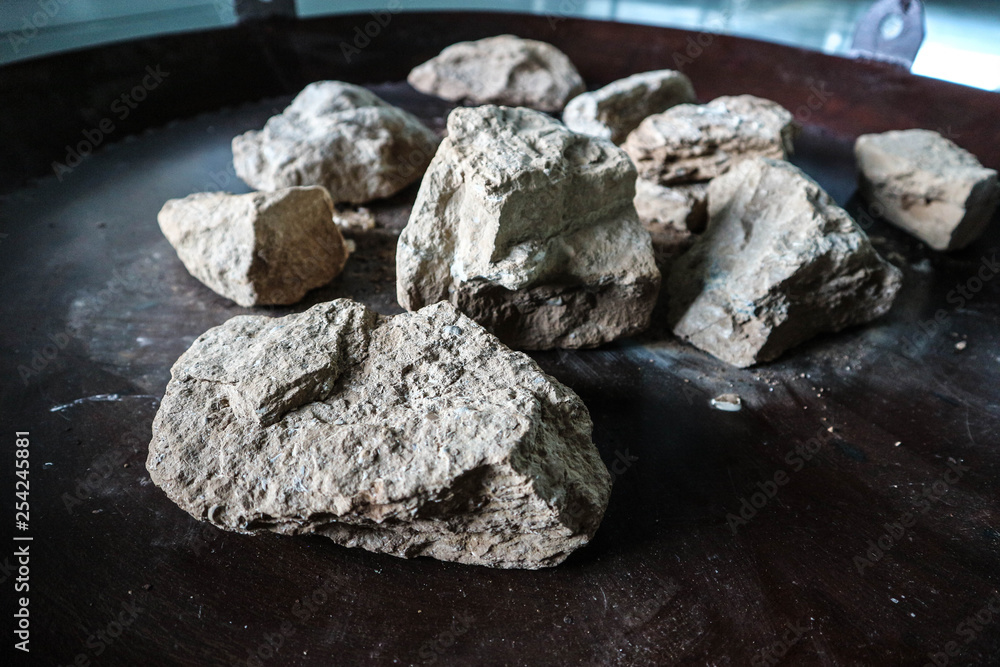 Big limestone pieces on the iron plate closeup Big limestone pieces on the iron plate closeup