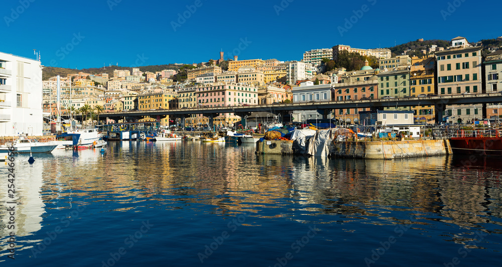 Old port of Genova and boats from sea view in Italy