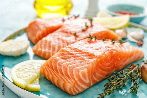 Seafood. Fresh raw salmon or trout fillets with ingredients