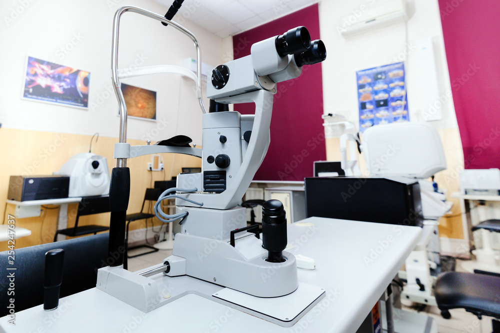 Special equipment for eye examination in an ophthalmologic clinic, in the foreground a slit lamp