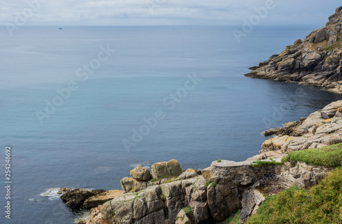 A view from the cliff top down towards the Minack Theatre near Porthcurno on the South Coast of Cornwall, England UK
