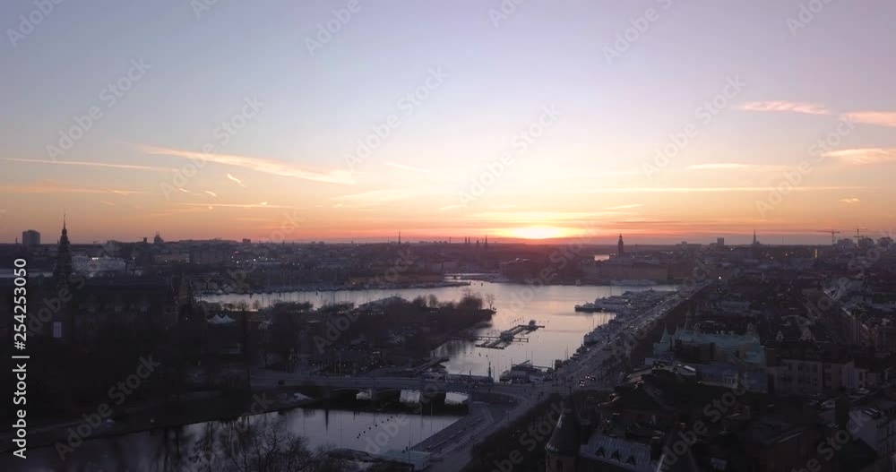 Majestic cold late night winter aerial drone view Stockholm Sweden. Magnificent crepuscular light skyline colors. Beautiful urban sunset cityscape silhouette. Majestic cold late night winter aerial drone view Stockholm Sweden. Magnificent crepuscular light skyline colors. Beautiful urban sunset cityscape silhouette.