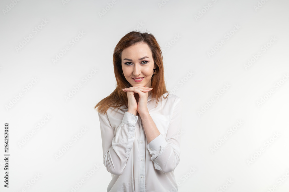 Portrait of beautiful brunette shy asian girl on white background Portrait of beautiful brunette shy asian girl on white background