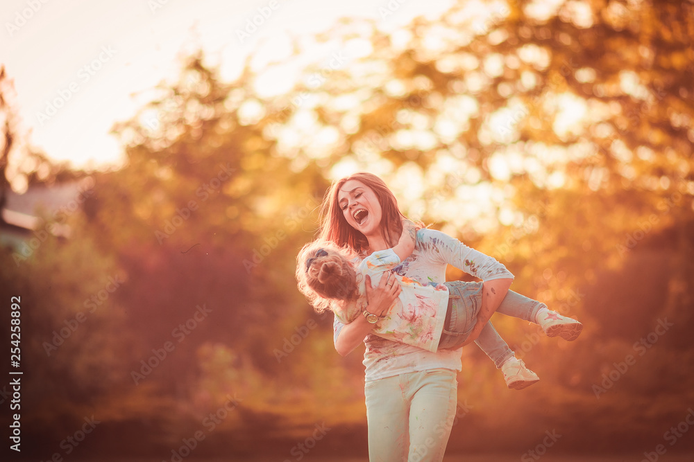 Fototapeta premium Mother and little daughter playing together outdoor