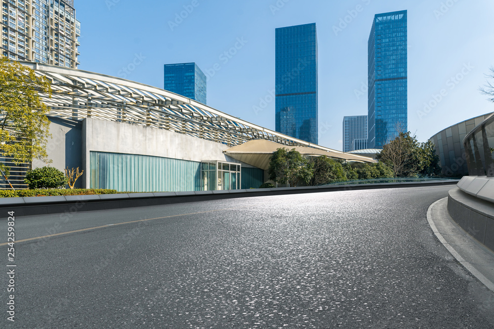 Empty ground of asphalt road with modern city and office building as  background Stock Photo | Adobe Stock