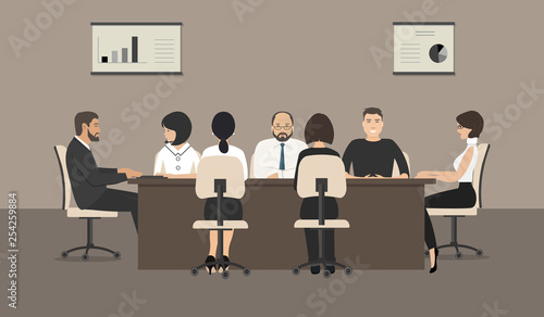 Office workers during the meeting. Employees are sitting at the table in the office. Conference hall. Vector illustration