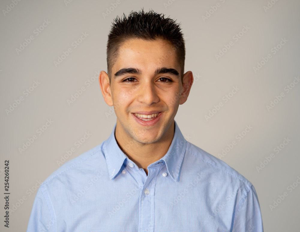Human beauty portraits and expressions. young attractive man smiling with happy face isolated on gray Human beauty portraits and expressions. young attractive man smiling with happy face isolated on gray