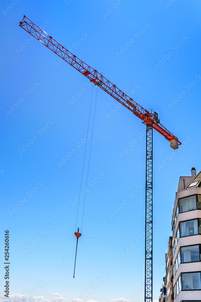 Working crane over the houses