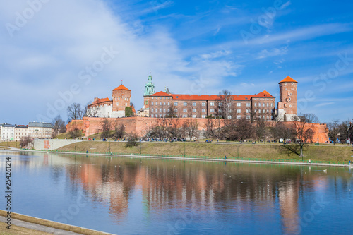 Wawel Royal Castle famous landmark in Krakow Poland. Picturesque landscape on coast river Vistula. Blue sky and cloud. February 23, 2019.