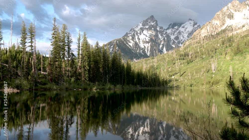 Jenny Lake with mountain reflection at Grand Teton National Park, Wyoming Jenny Lake with mountain reflection at Grand Teton National Park, Wyoming