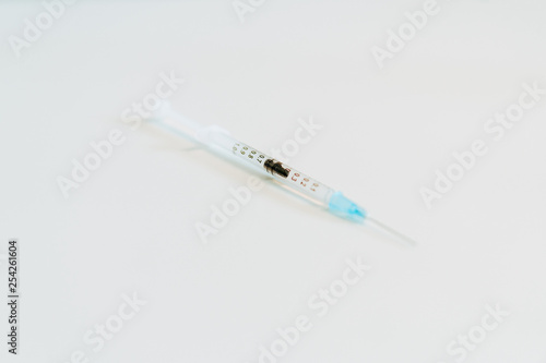Syringe prepared for administration of the vaccine.