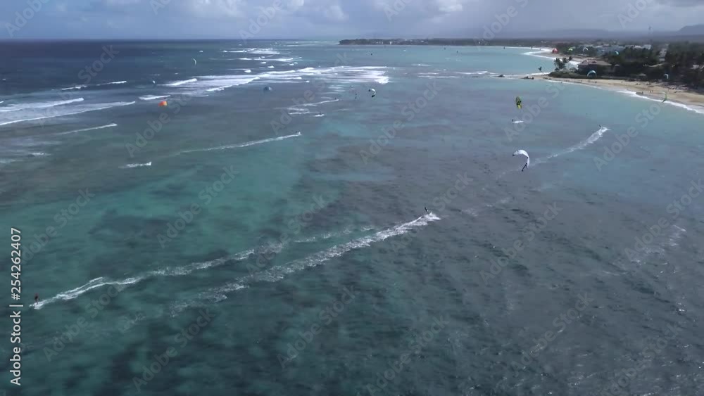 AERIAL view of multiple kite surfers off the beach in Cabarete, Dominican Republic. AERIAL view of multiple kite surfers off the beach in Cabarete, Dominican Republic.