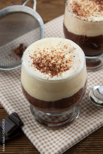 Coffee affogato with vanilla ice cream and espresso. Glass with coffee drink and icecream.