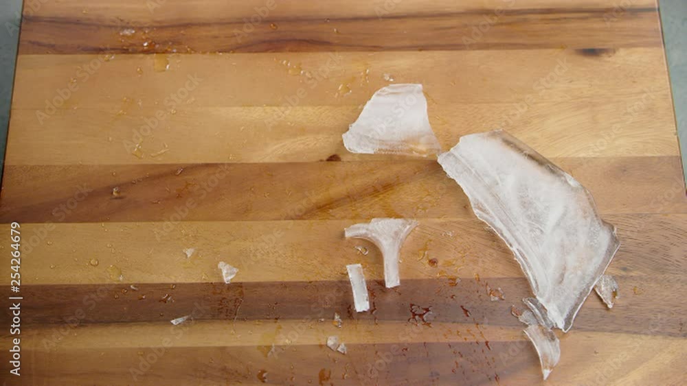 Ice water dripping and packed frozen meal plastic container falling on ...