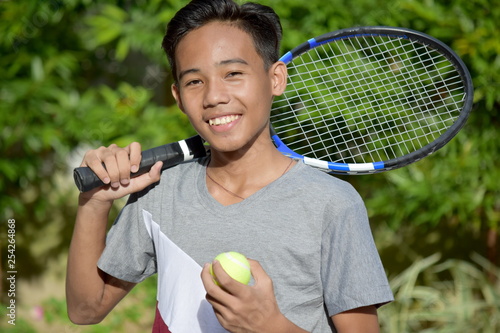 Fitness Filipino Male Tennis Player And Happiness With Tennis Racket © dtiberio
