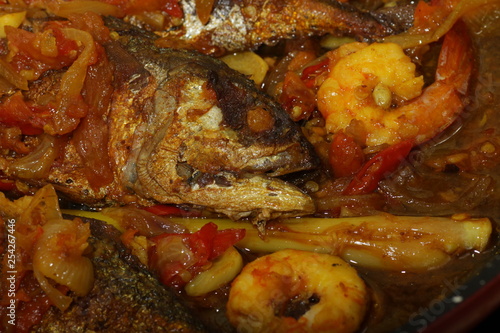 Fish cooked with chillies 