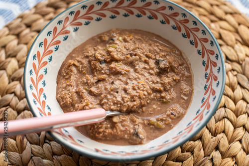 overnight oats with orange, apple, cocoa and dried plums