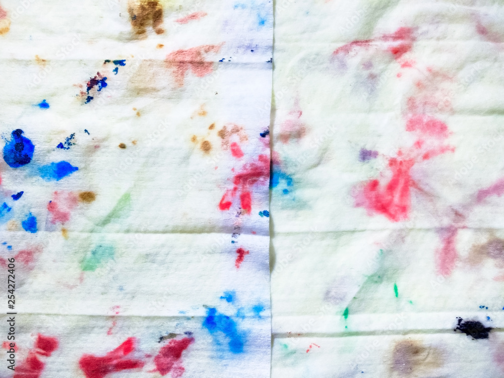 The cloth dirty after cleaning the brush, random colorful pattern on white textured background The cloth dirty after cleaning the brush, random colorful pattern on white textured background