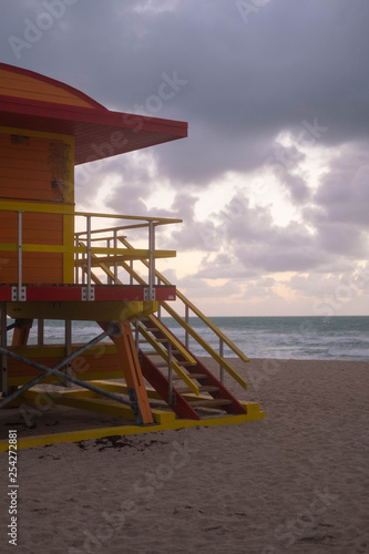 Orange and Yellow Beach Hut on Miami Beach in Florida at sunrise over looking the sea © Elsie